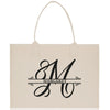 a white shopping bag with the letter m on it