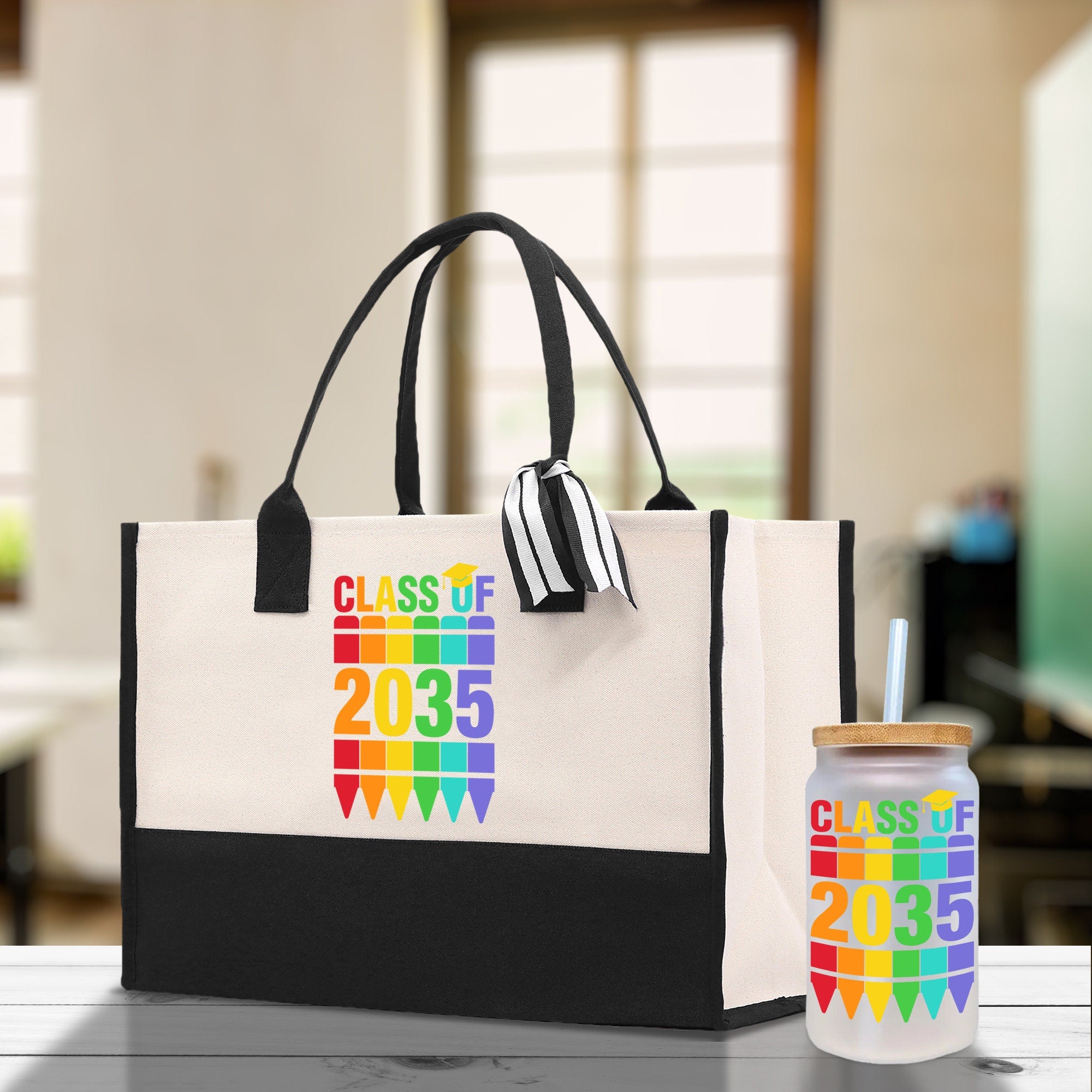 a white bag with a black handle and a rainbow design on it