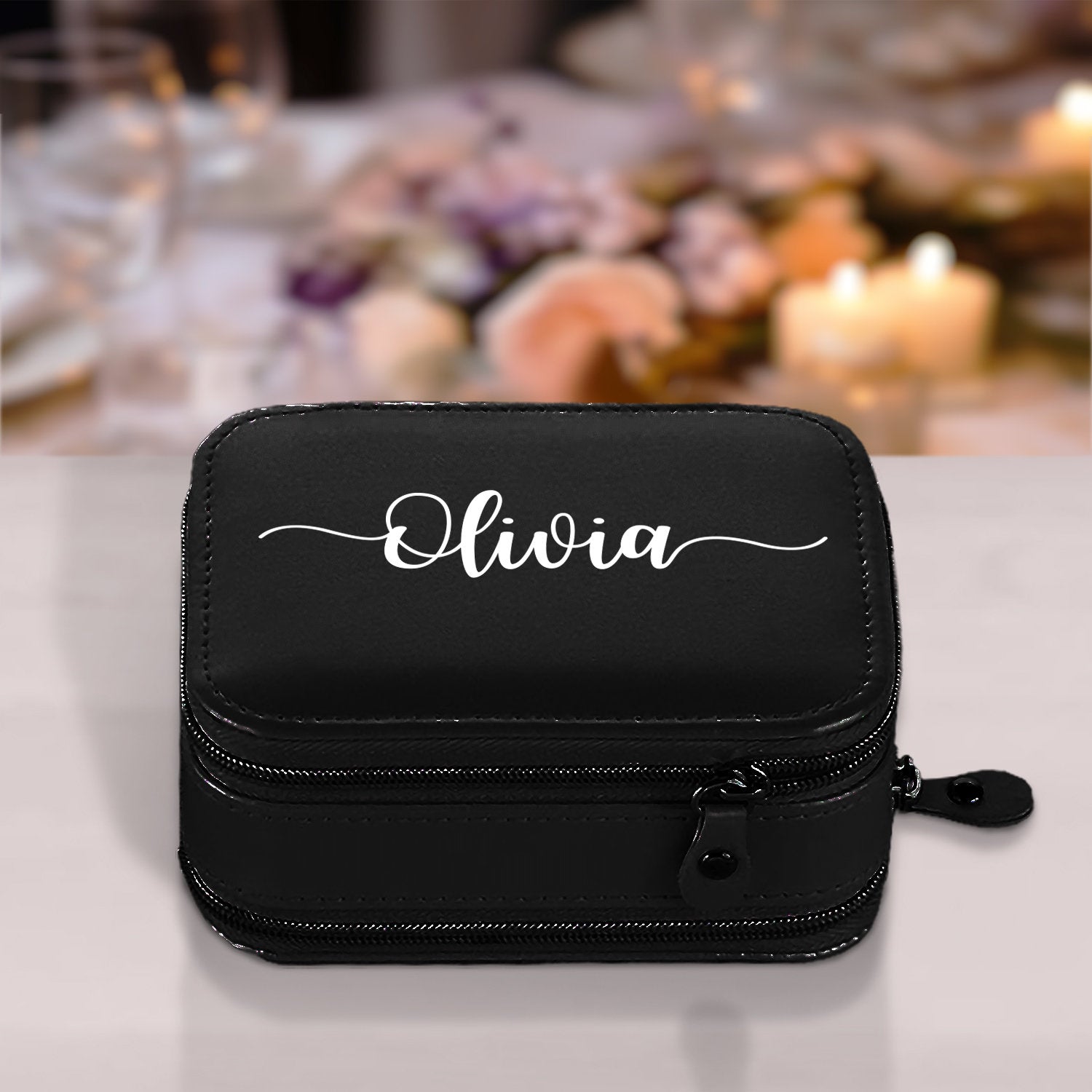 a personalized black cosmetic case with a name on it