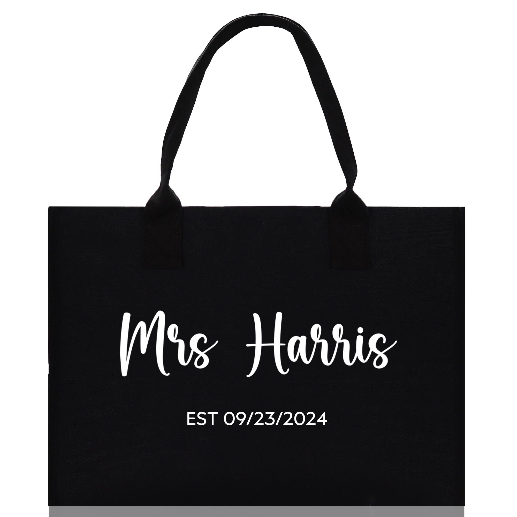 a black shopping bag with the words mrs harris on it