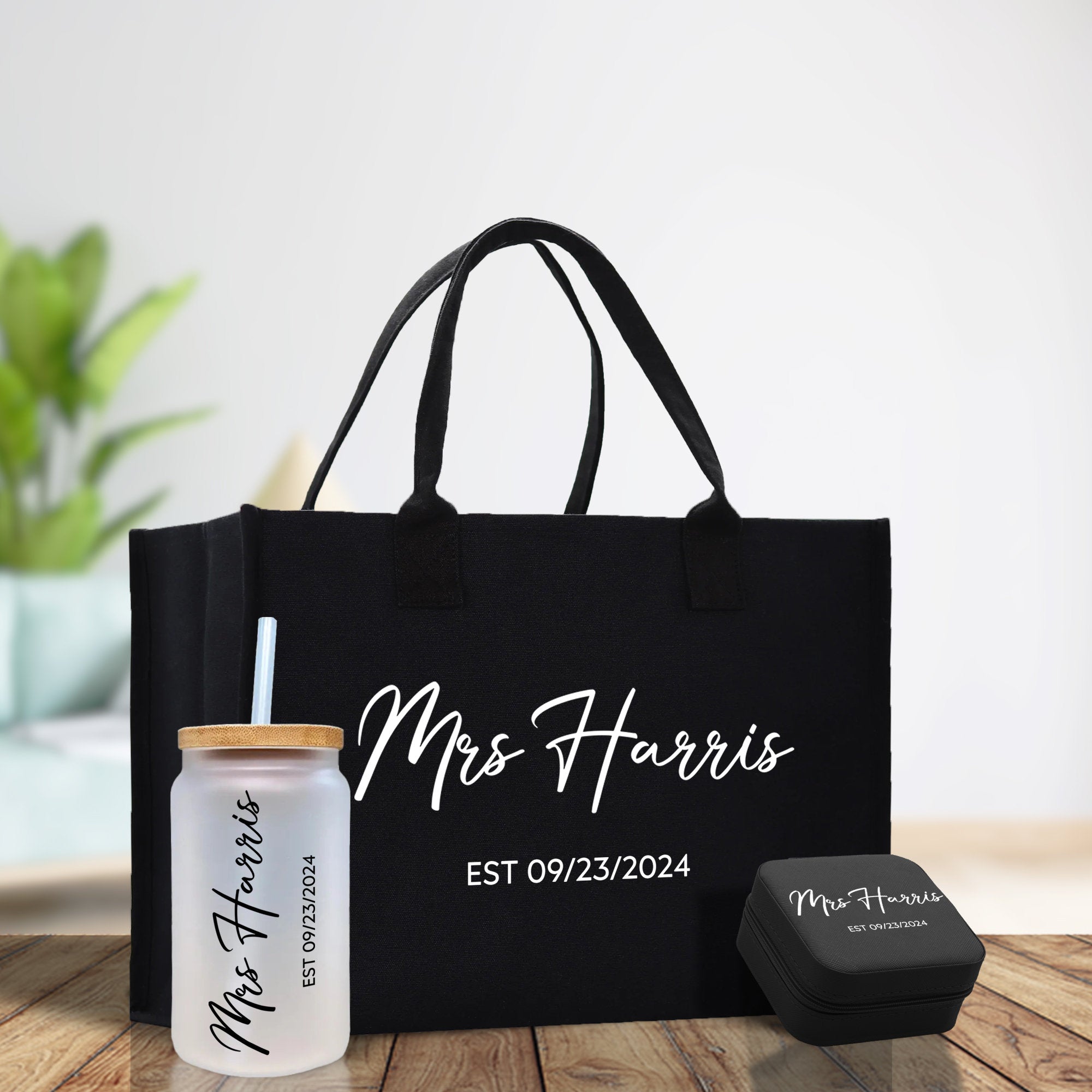 a black tote bag with a drink and a personalized tote bag