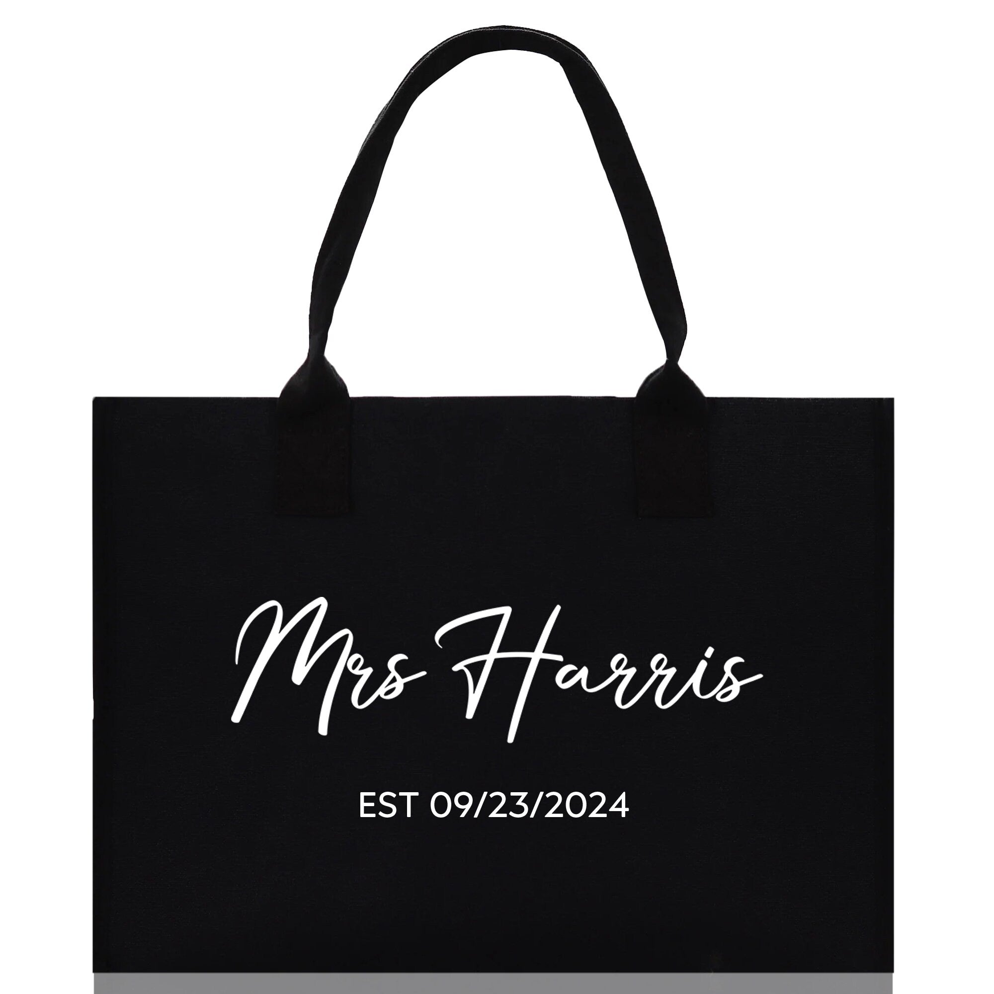 a black tote bag with the words mrs harris on it