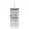 a white mason jar with a straw in it
