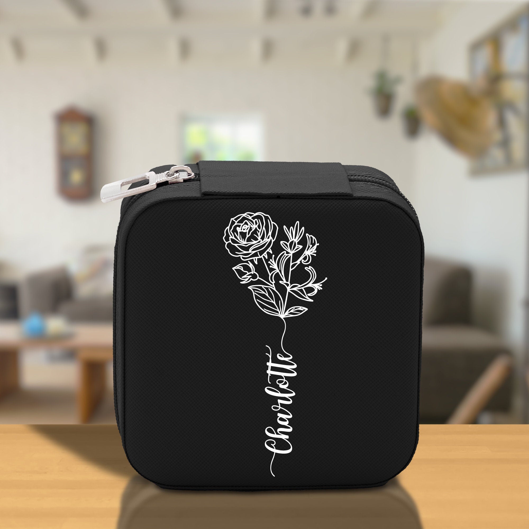 a black case with a white flower on it