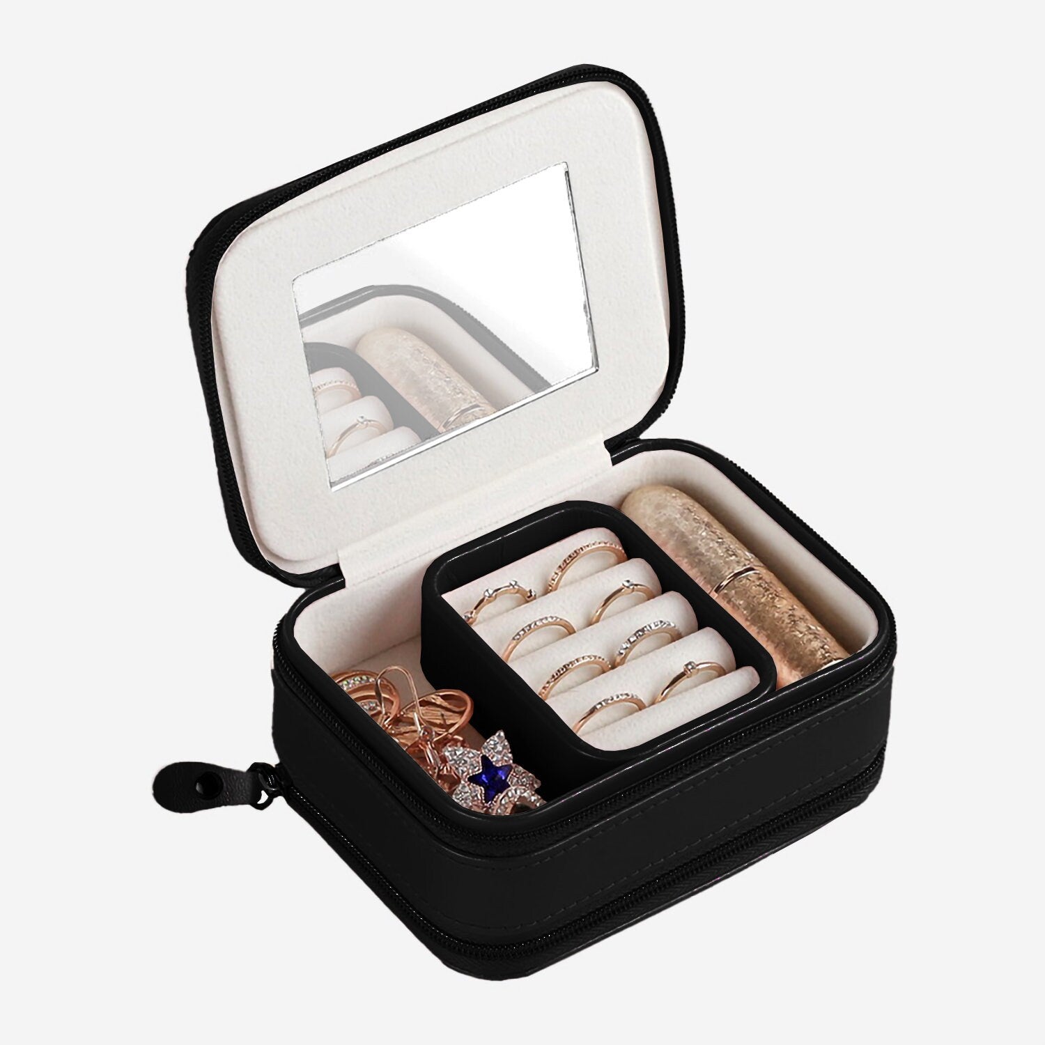 a black case filled with jewelry and a mirror