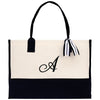 a black and white bag with a monogrammed a on it