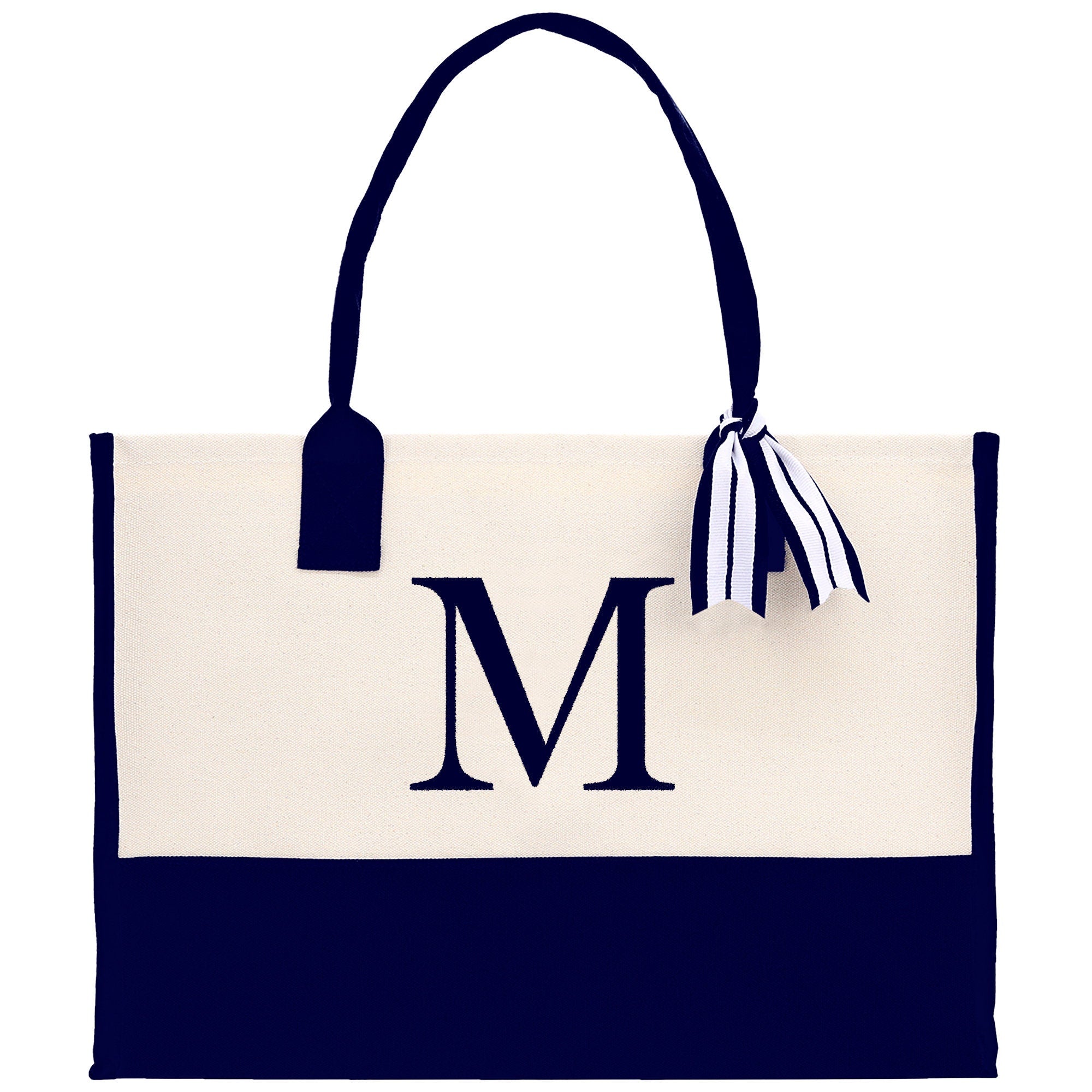 a white and black bag with a monogrammed m on it