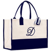 a white and black bag with a monogrammed d on it