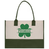 a green and white bag with a four leaf clover