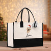 a white and black shopping bag with a poodle on it
